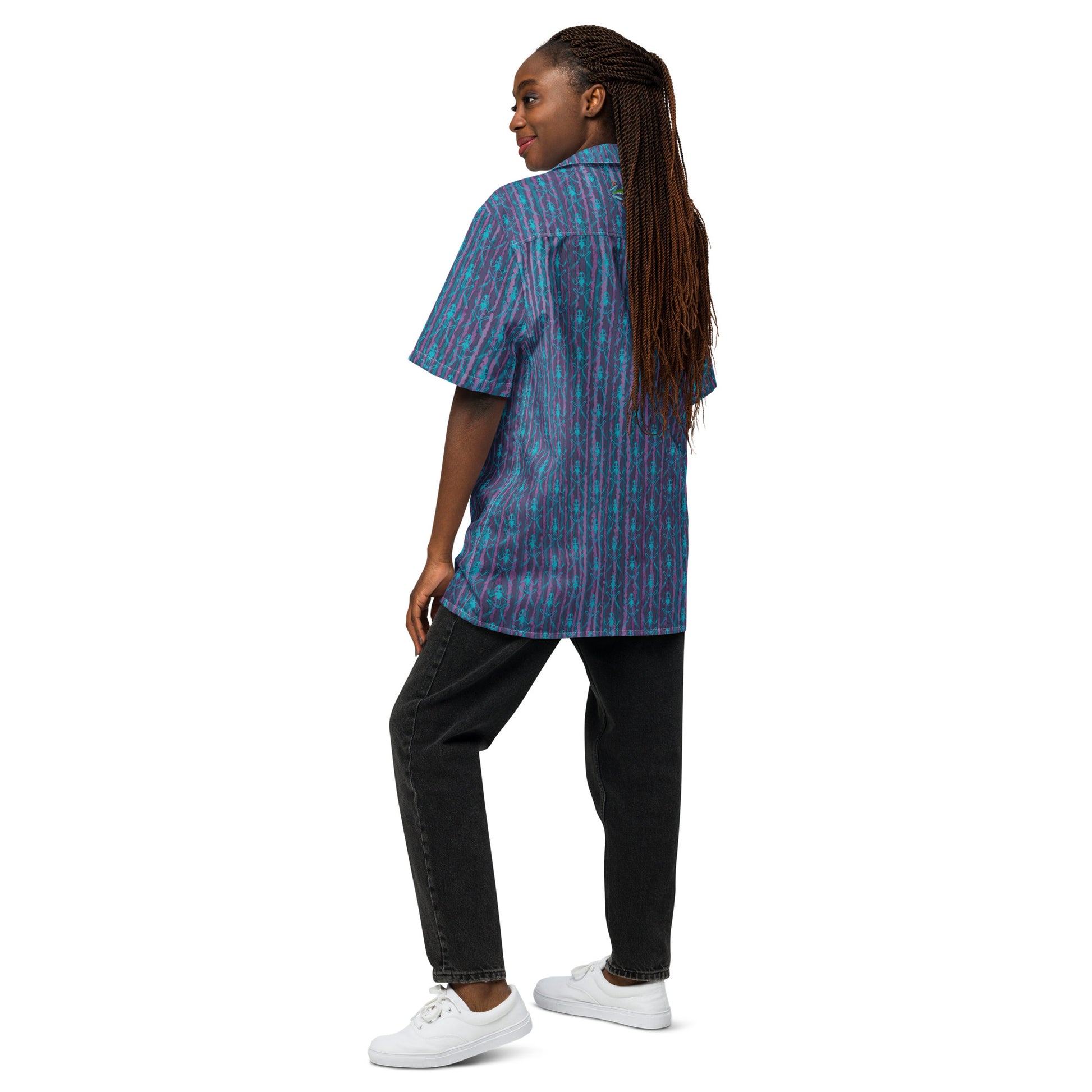 Model wearing the Anura button down shirt with turquoise frog bones from the back.