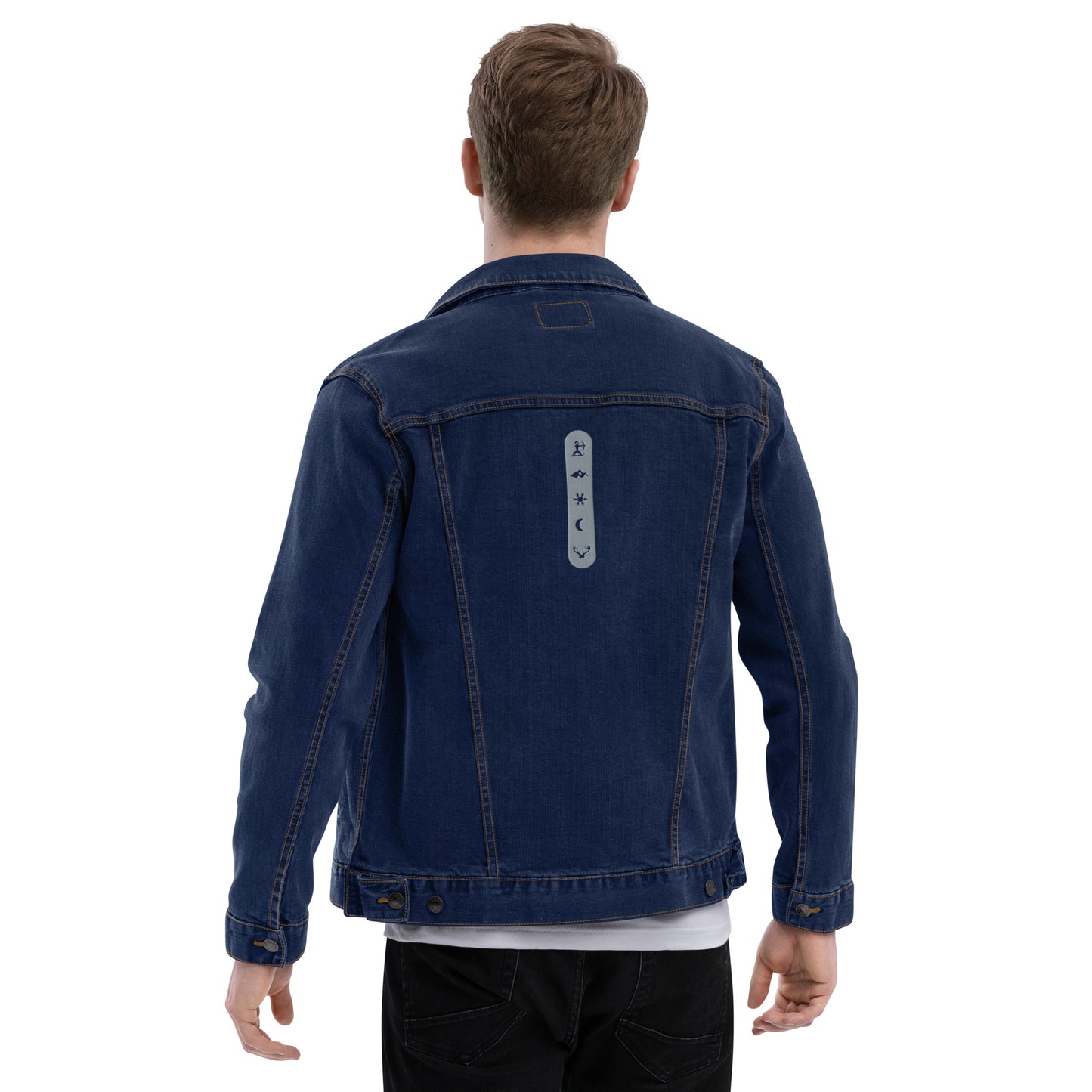 Model wearing House Ullr Unisex Denim Jacket from the back in blue Denim with arms away from the body.